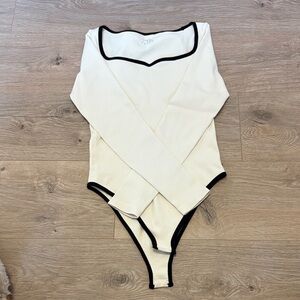 Cream Long-Sleeve Baby Bodysuit with Black Trim